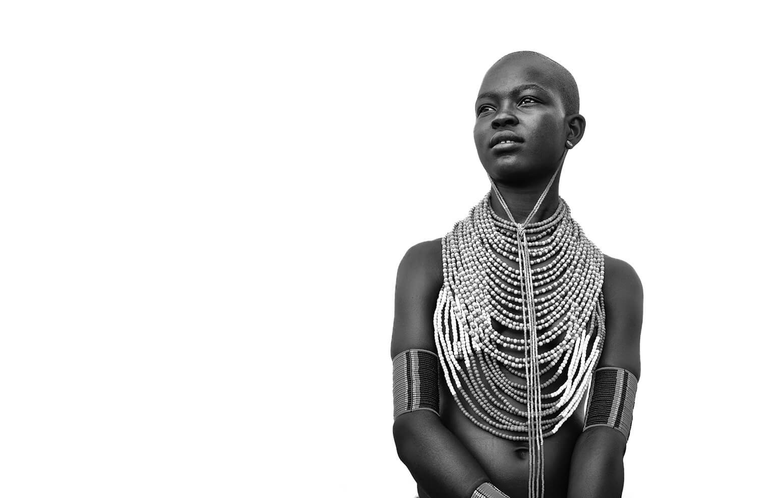 This young woman from the Hamer tribe in the Omo Valley, Ethiopia took my breath away.  She combined the rich heritage of her culture along with beauty, elegance and grace. There are no mirrors in her village. It was a joy to show the members of the 