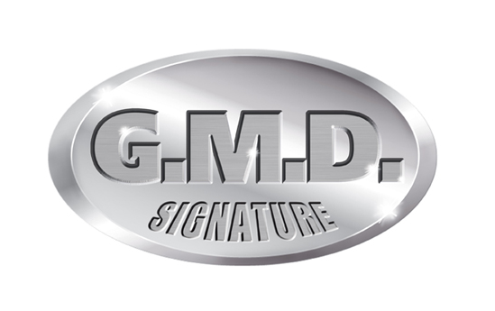 G.M.D. Signature logo in a silver oval with a shiny, metallic finish.