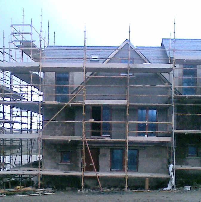 House under construction with scaffolding