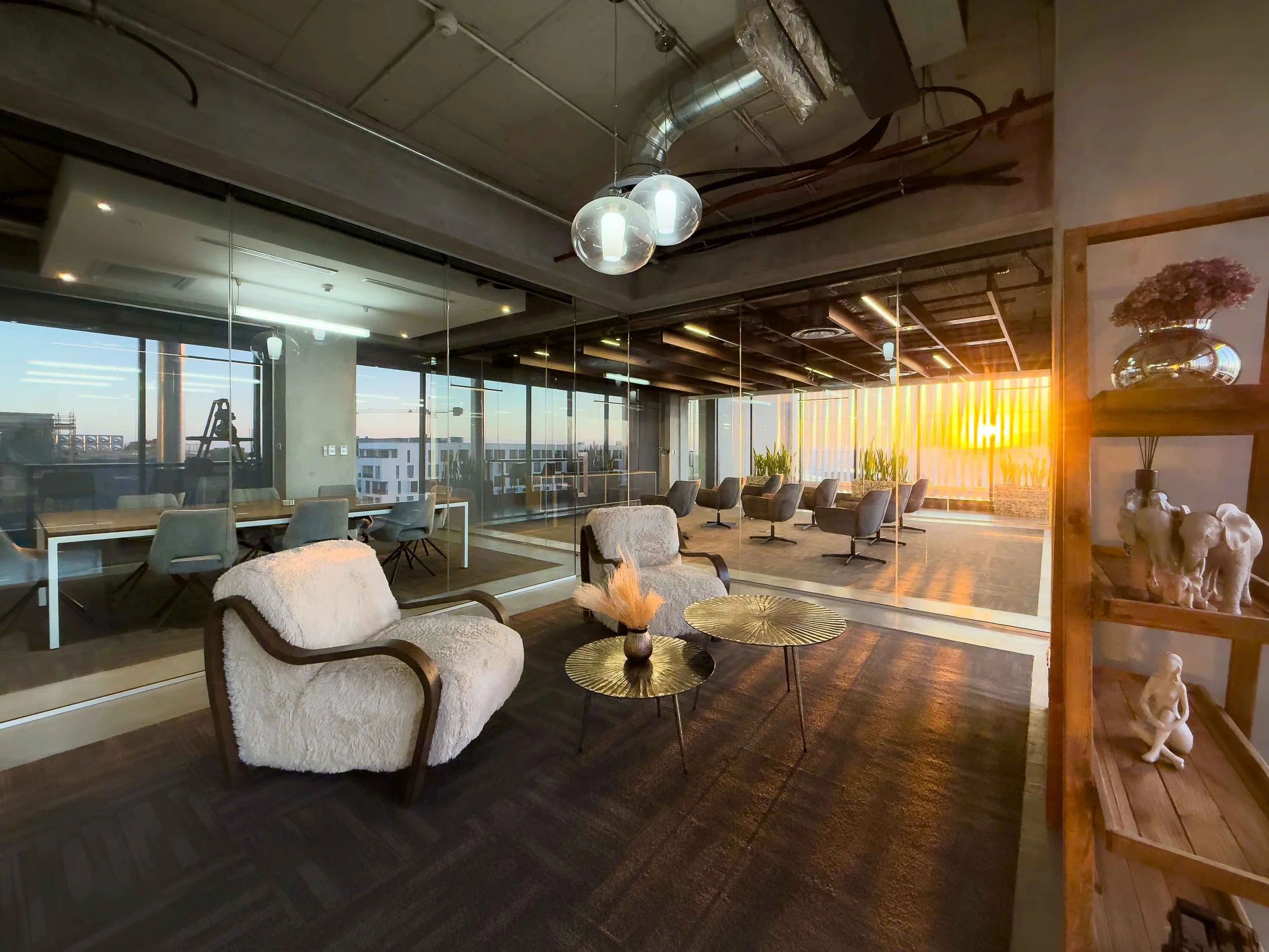 A close-up of a Shure SM7B microphone in front of an audio mixer or soundboard with various sliders and controls, placed on a wooden surface.