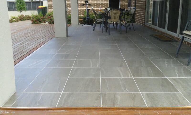 Tiling outside under patio. 