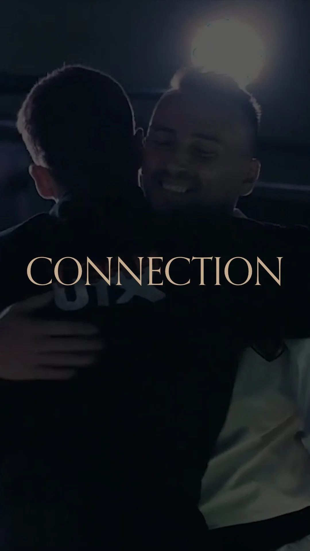 Two people hugging with the word 'Connection' overlaid in beige text.