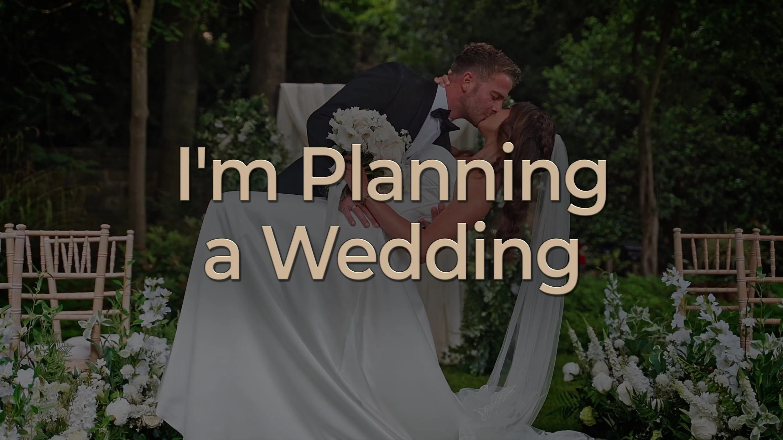 Image of a married couple kissing in front of their guests at a wedding ceremony. Overlay text reads "I'm Planning a Wedding"