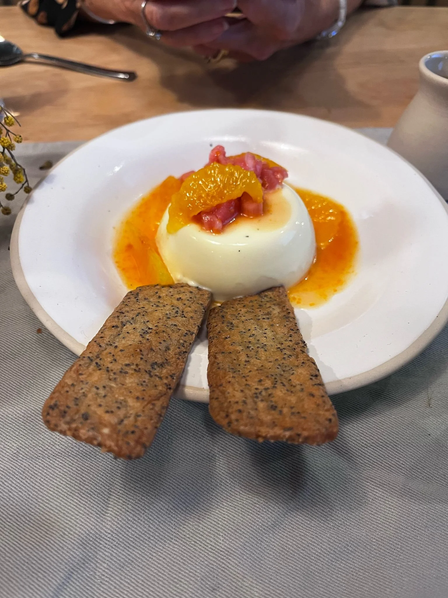 Black cardamom panna cota with rhubarb, Bitter oranges and poppyseed Biscuit