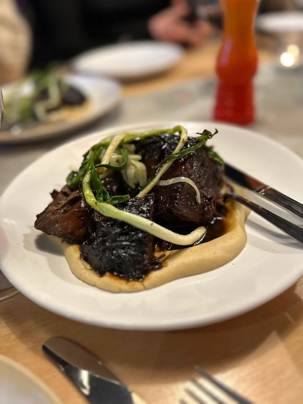Braised Featherblade on braised fava and pickled Spring onion