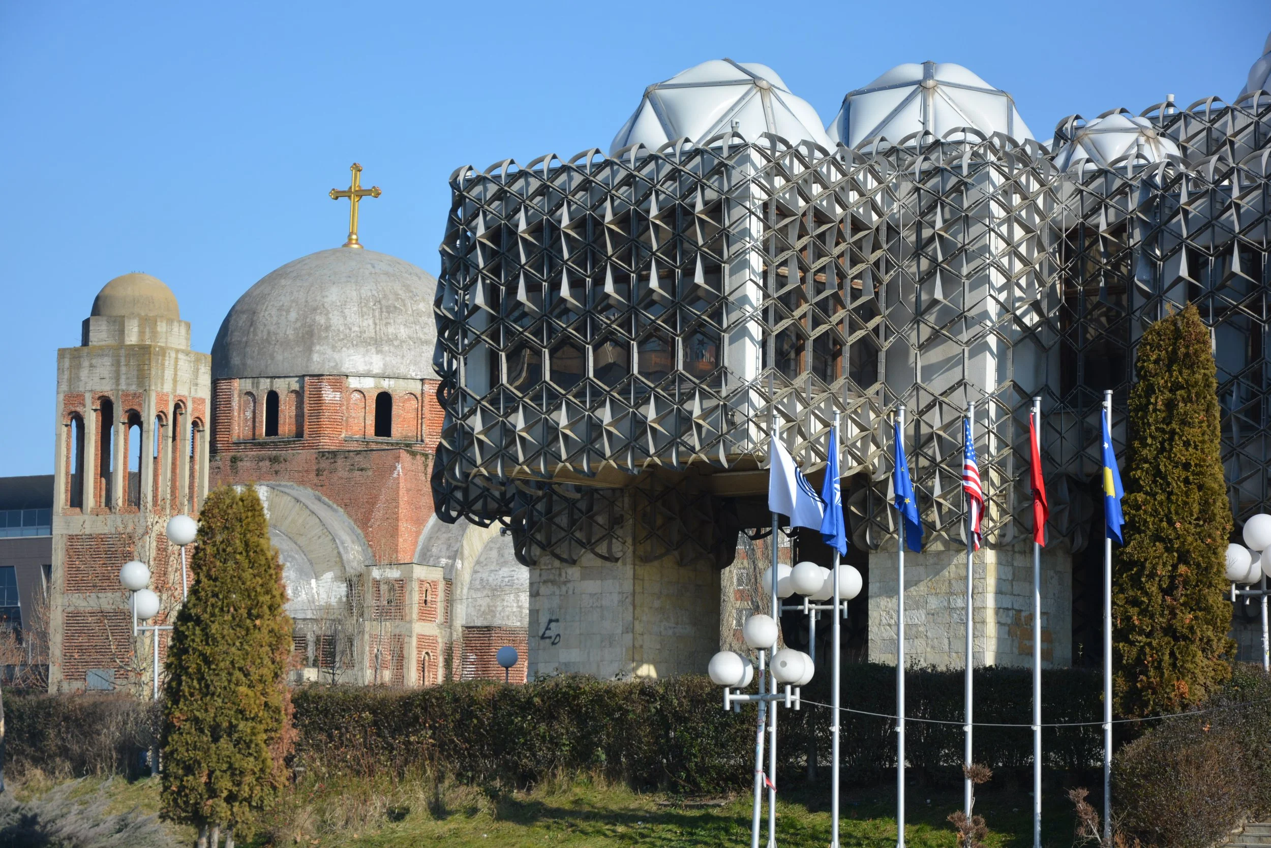 The iconic library in Pristina built in Tito's Yugoslavia when Kosovo-Metohija was an autonomous unit of Serbia. A Serbian Orthodox church in the background, often targeted previously by Albanian nationalists. 