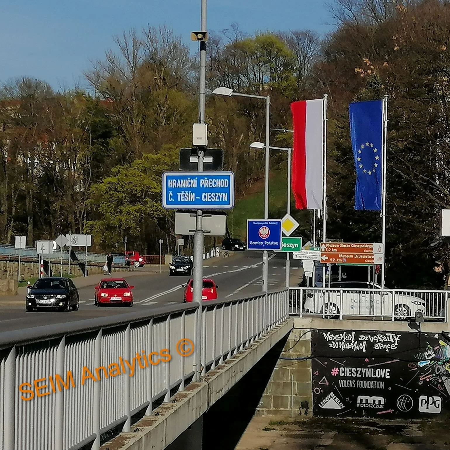 Border crossing sign at Cieszyn (Češky Tešin), with Polish and European Union flags, now peaceful and without border control, but in the interwar period a conflict flashpoint between Poland and Czechoslovakia.