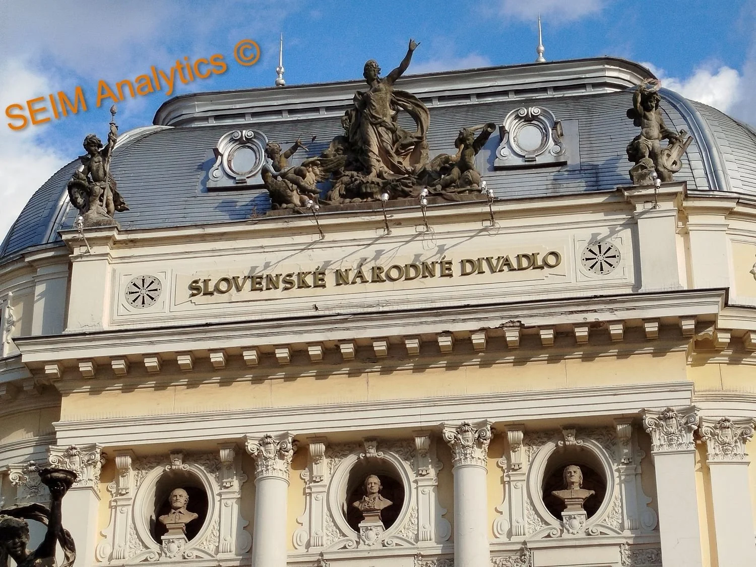 Exterior view of Slovenské Národné Divadlo (Slovak National Theatre), a historic building with classical architectural elements, columns, and sculptures.