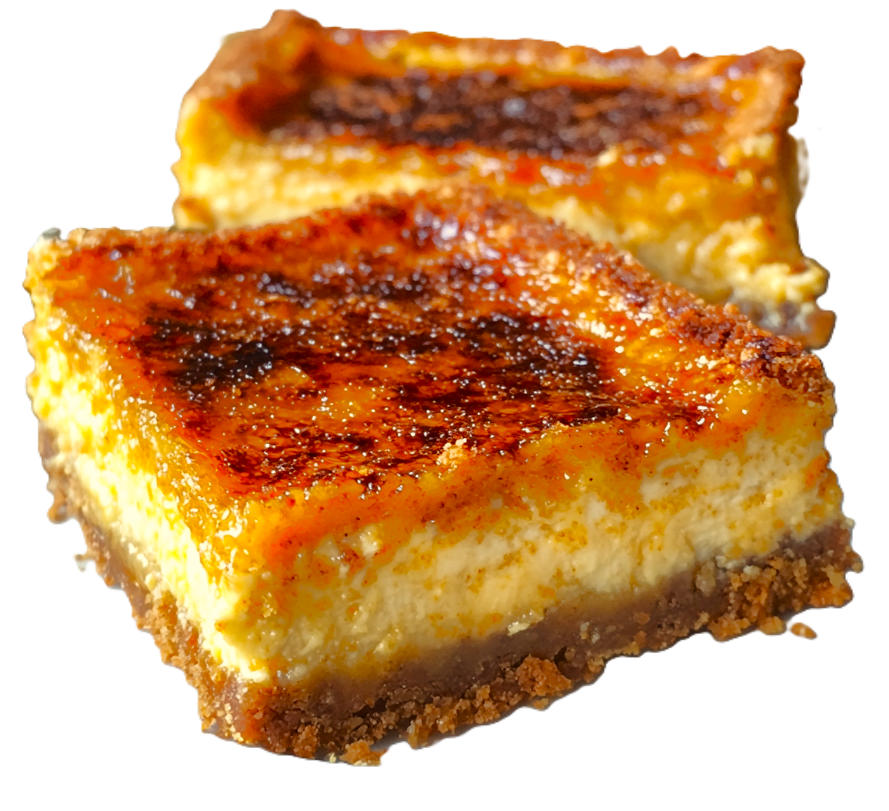 Pumpkin crème brûlée cheesecake bars with a golden sugar crust, sliced and ready to serve.