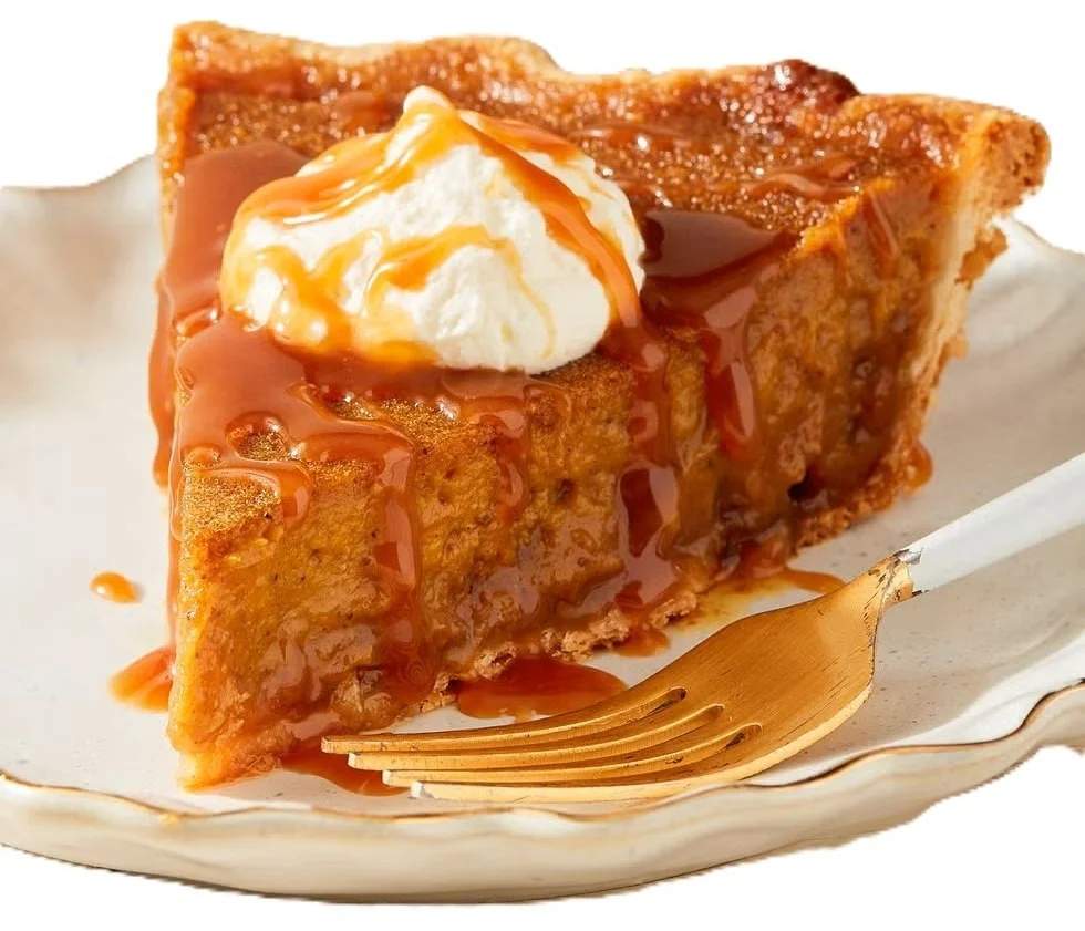 A slice of creamy pumpkin caramel pie showing the caramel layer and flaky crust.