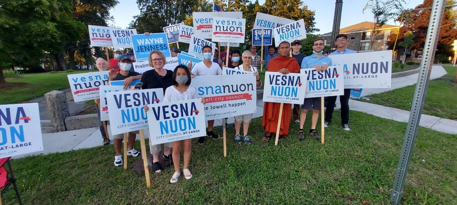 Supporters of Vesna Nuon's campaign for Lowell City Council hold signs