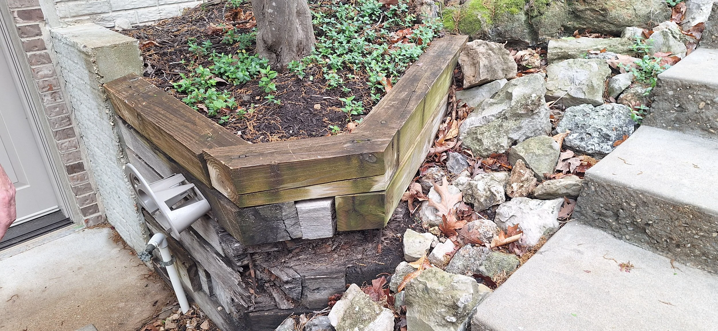 Old tie retaining wall, tearing out for new Belveder block wall