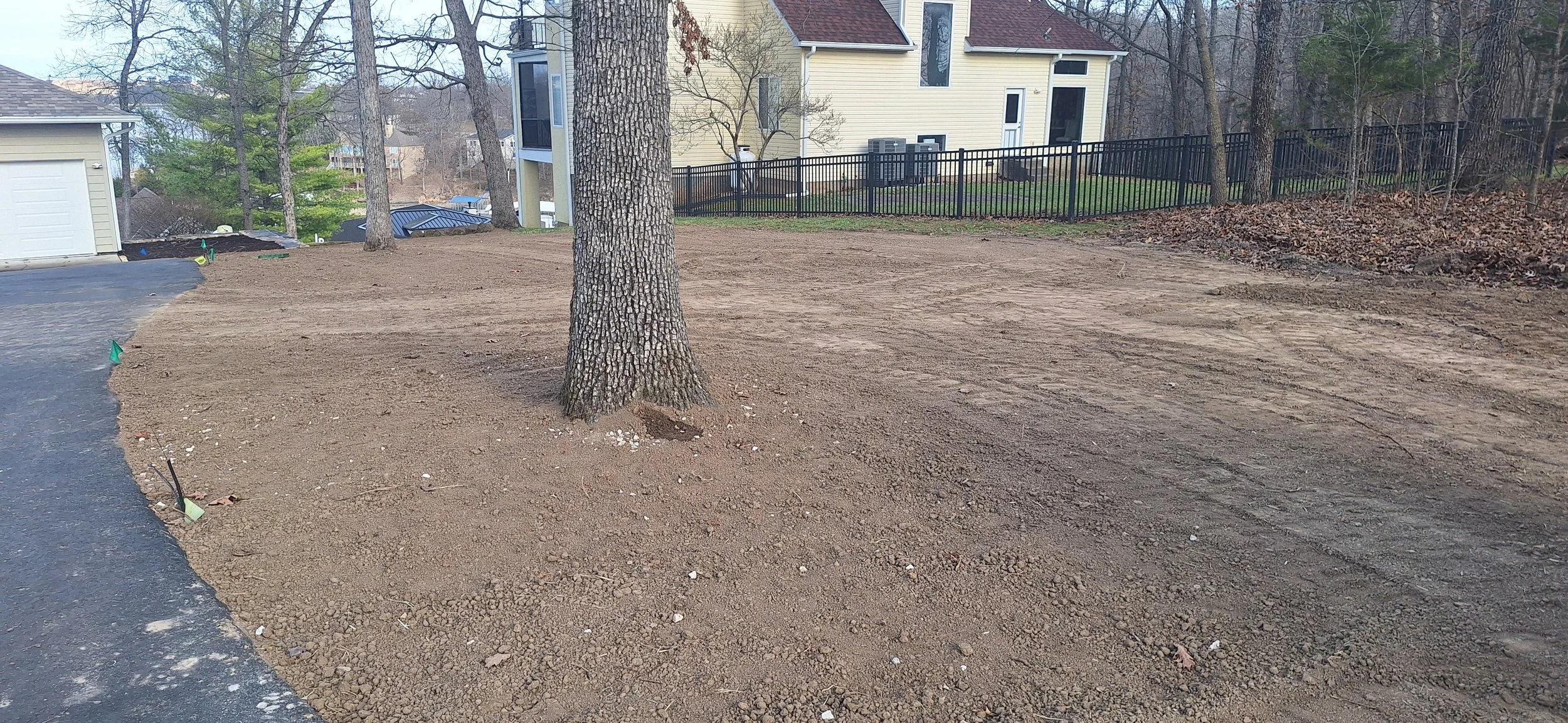 Irrigation, corrected grade, prepping for sod.