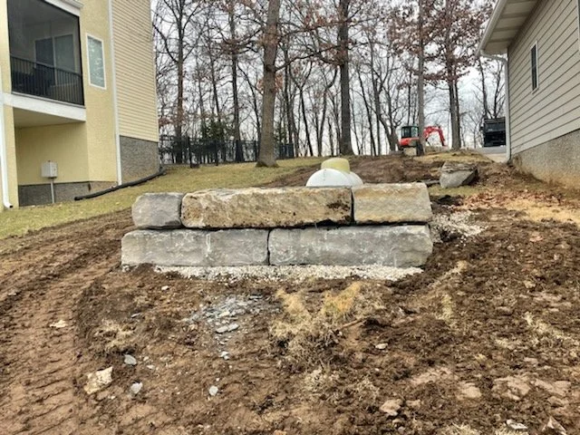 Ledgestone wall, correcting grade, dirt for sod.