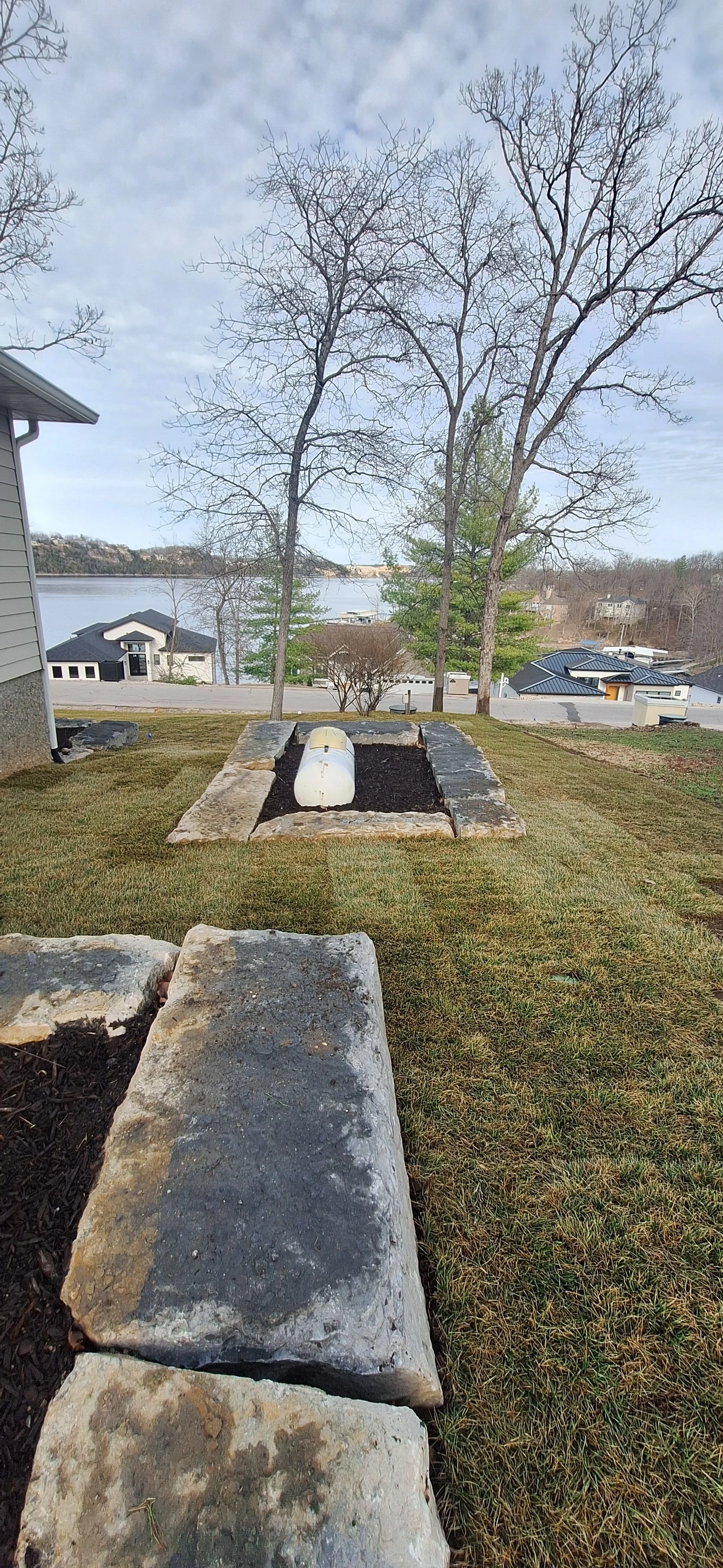 Ledge stone walls, sod.