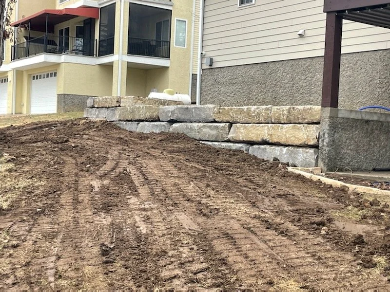 Ledgestone wall, correcting grade, dirt for sod.