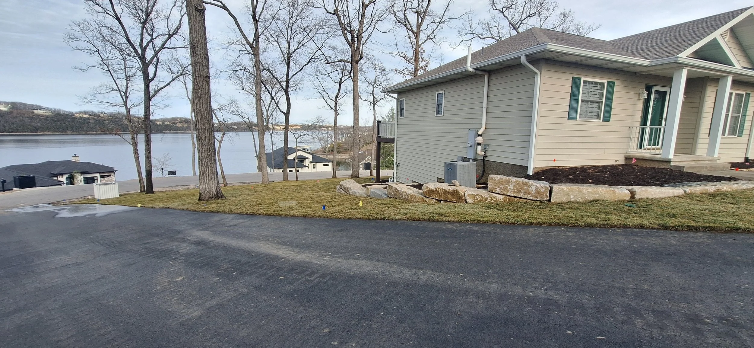 Ledgestone walls, planting space, sod.