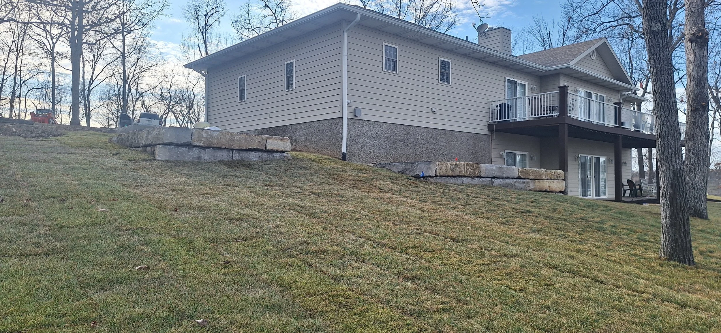 Ledgestone walls, sod, irrigation.
