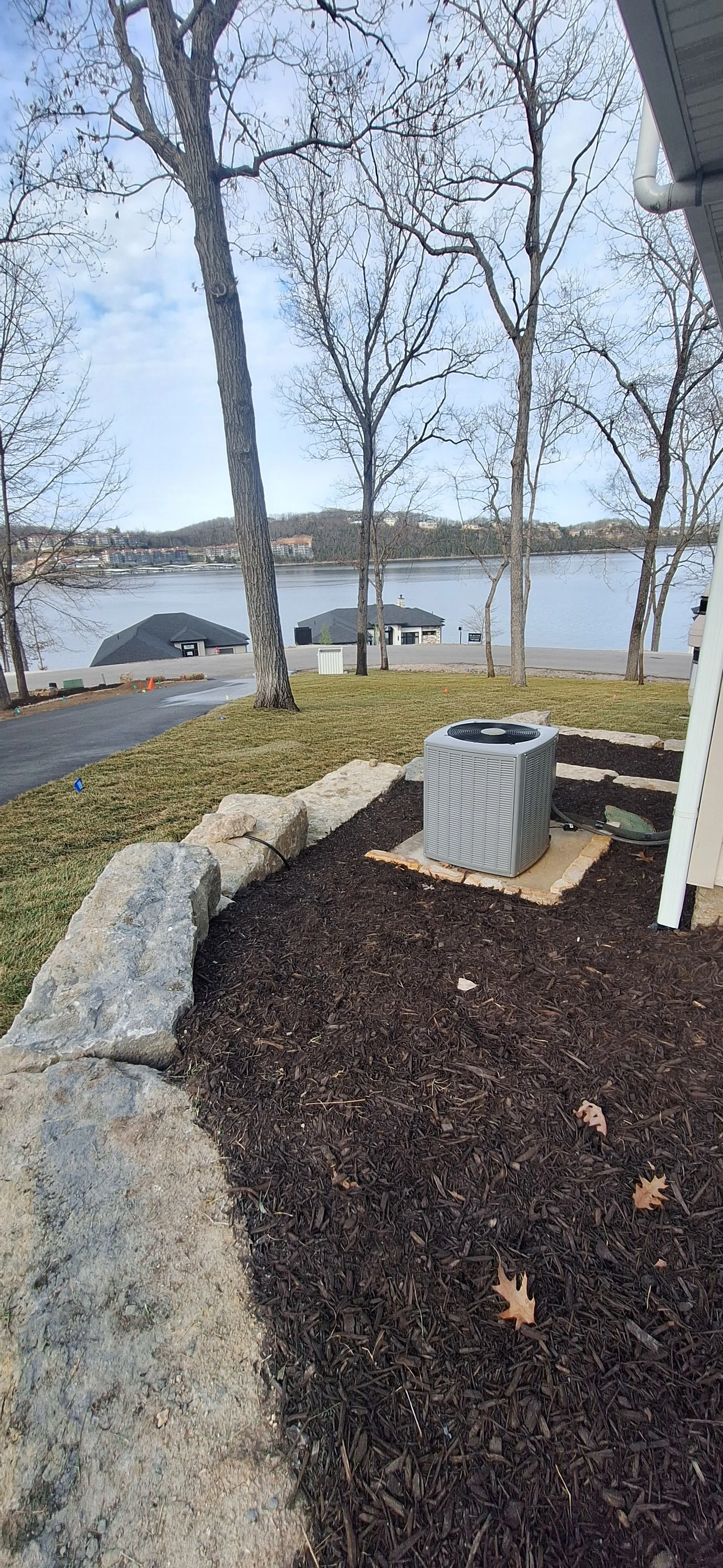 Ledge stone walls, planting space, mulch, sod