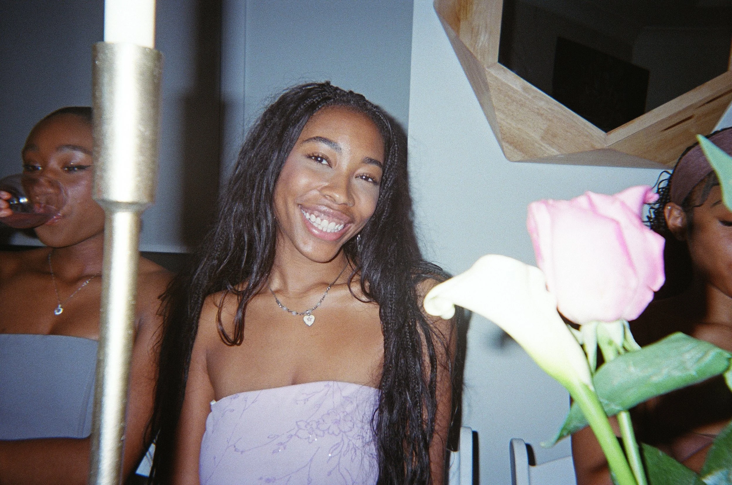 Nicole Stewart is smiling at a dinner table