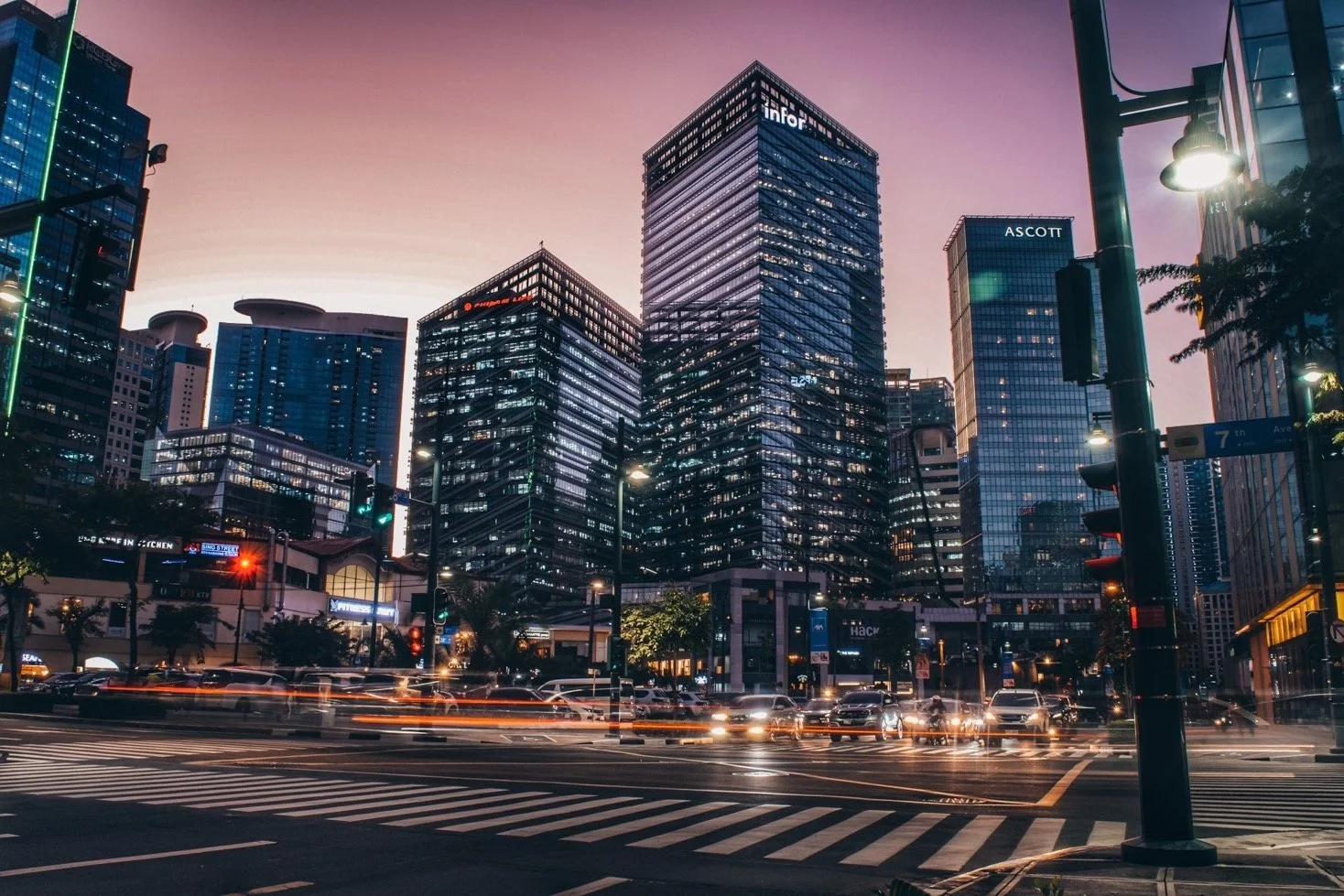 Six/NEO and Seven/NEO towers in Bonifacio Global City at dusk