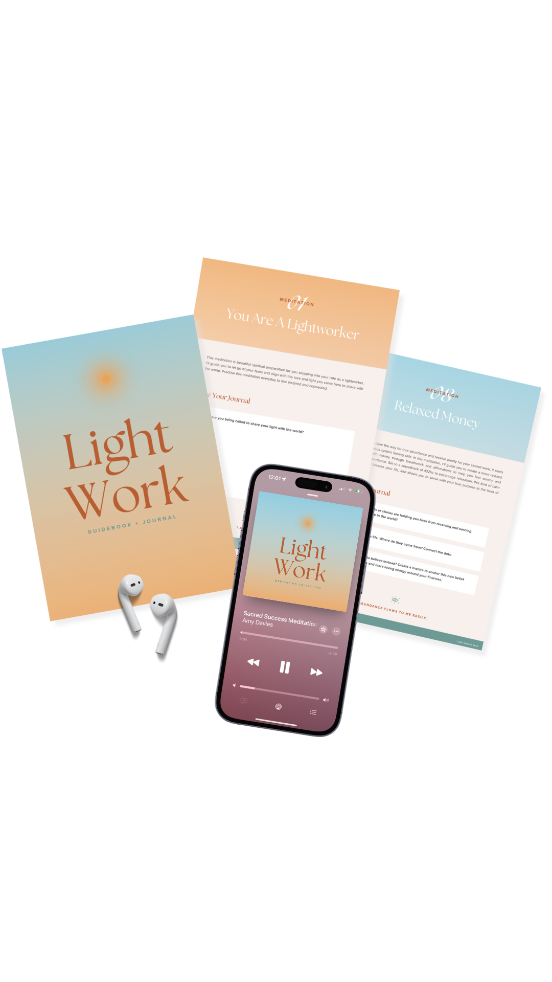 A collection of meditation and mindfulness items, including a hardcover book titled 'Light Work,' two pamphlets titled 'You Are A Lightworker' and 'Relaxed Money,' a smartphone displaying a meditation app playing 'Sacred Success Meditation' by Amy Davies, and a pair of wireless earbuds.