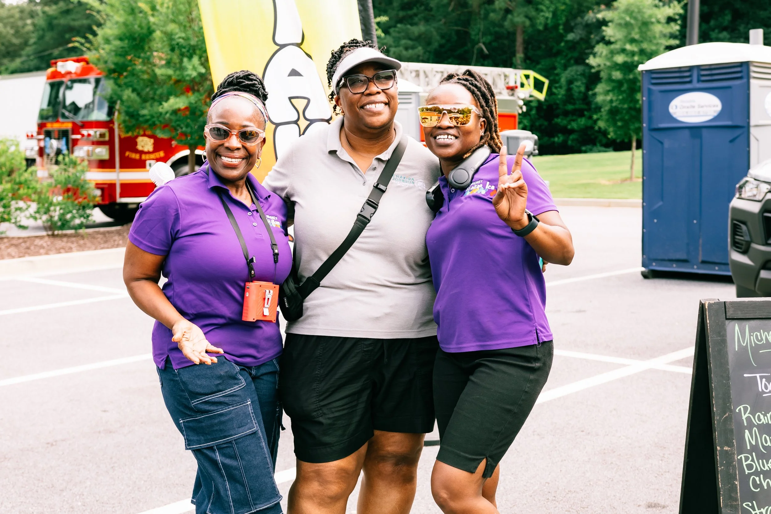 Commissioner Chakira Johnson poses with two representatives from Michey’s Italian Ice at Chakira’s Cookout.