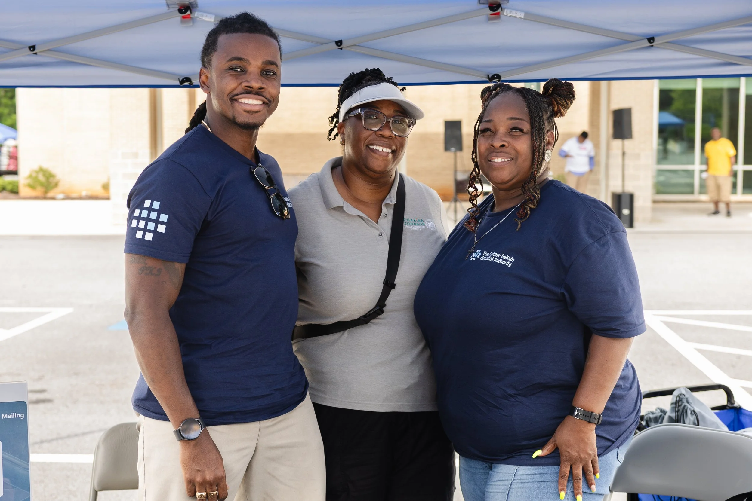 Commissioner Chakira Johnson poses with two Fulton-DeKalb Hospital Authority staff members at Chakira’s Cookout.