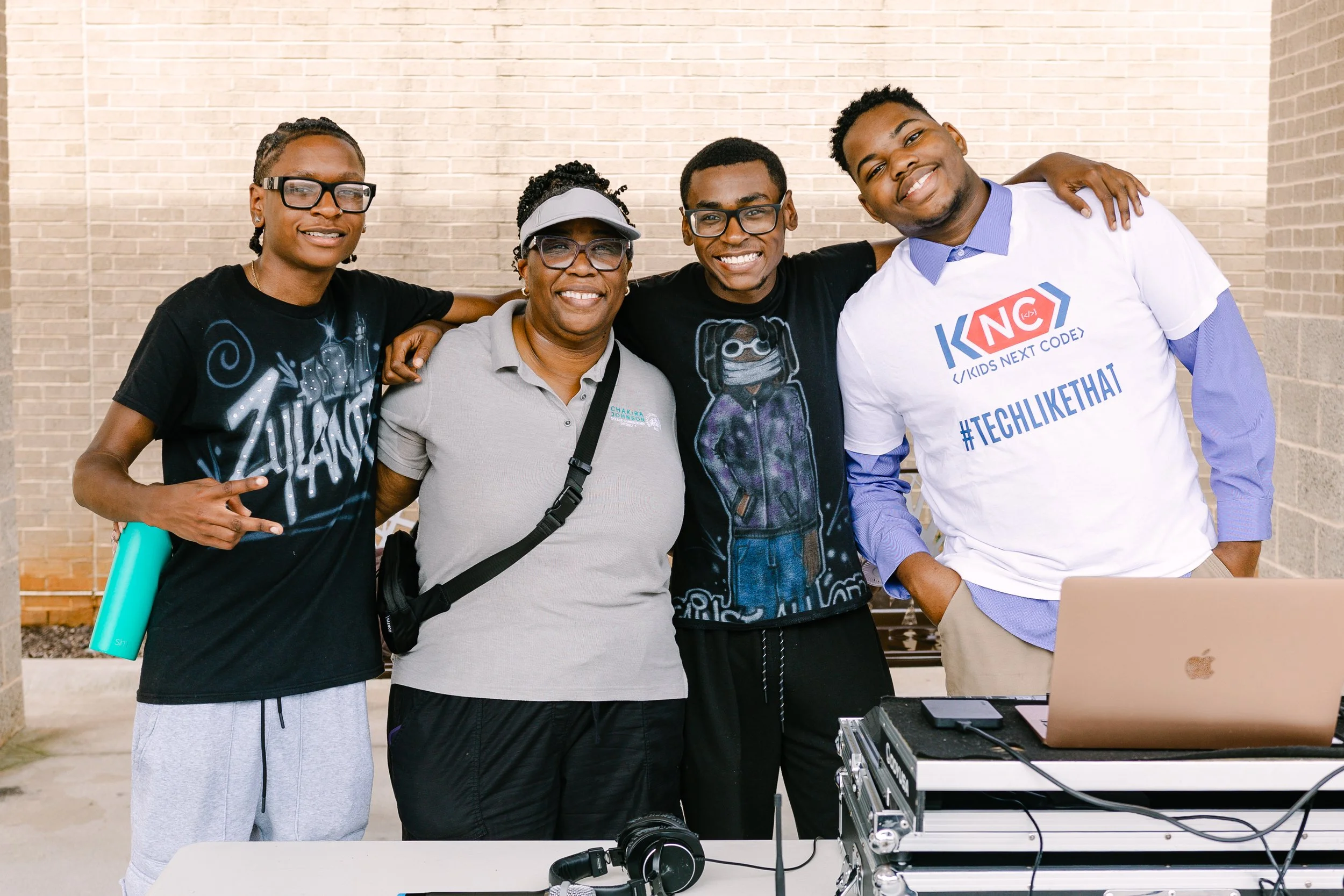 Commissioner Chakira Johnson poses with the event DJs and a representative from Kids Next Code during Chakira’s Cookout.