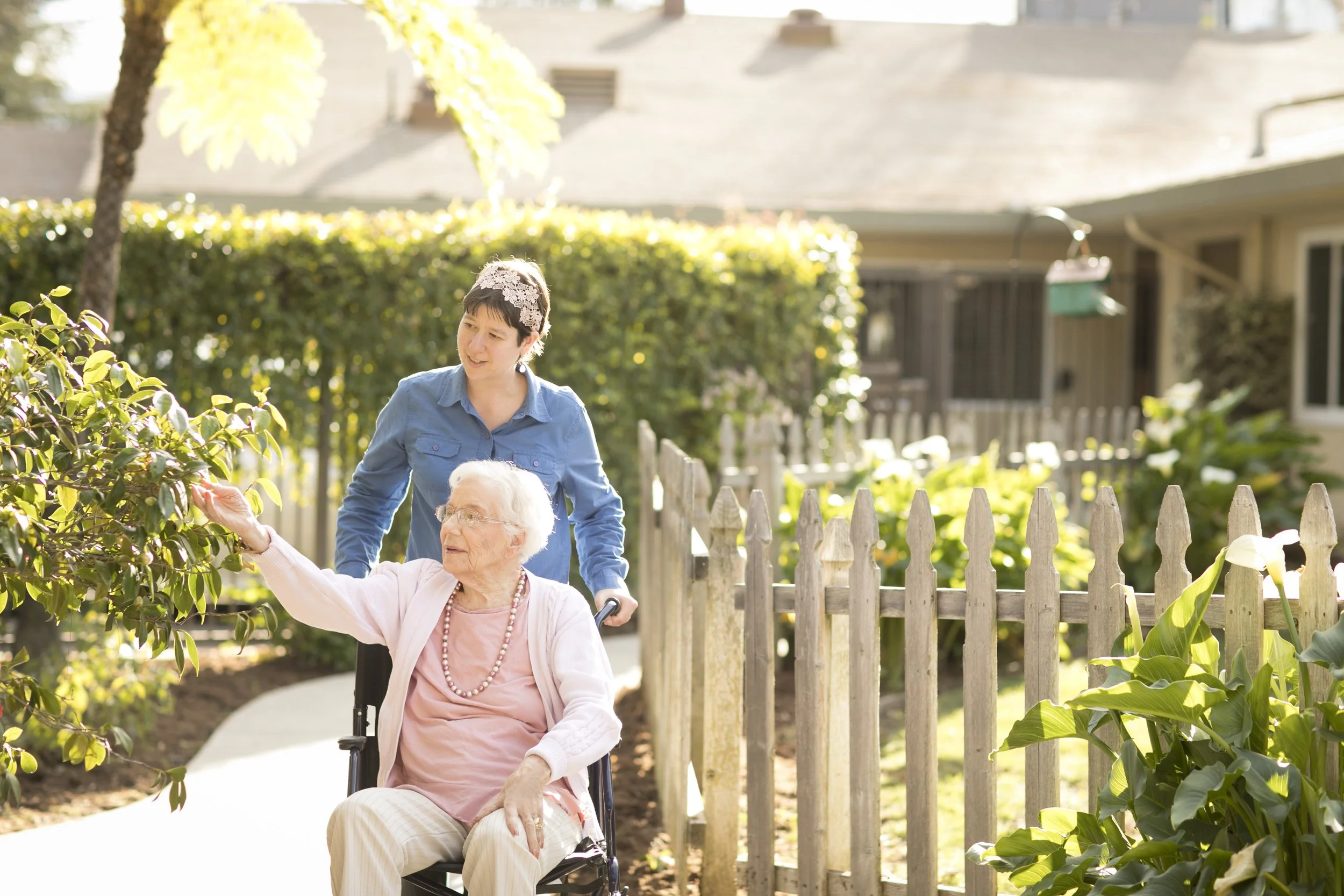 Staff with resident in wheelchair