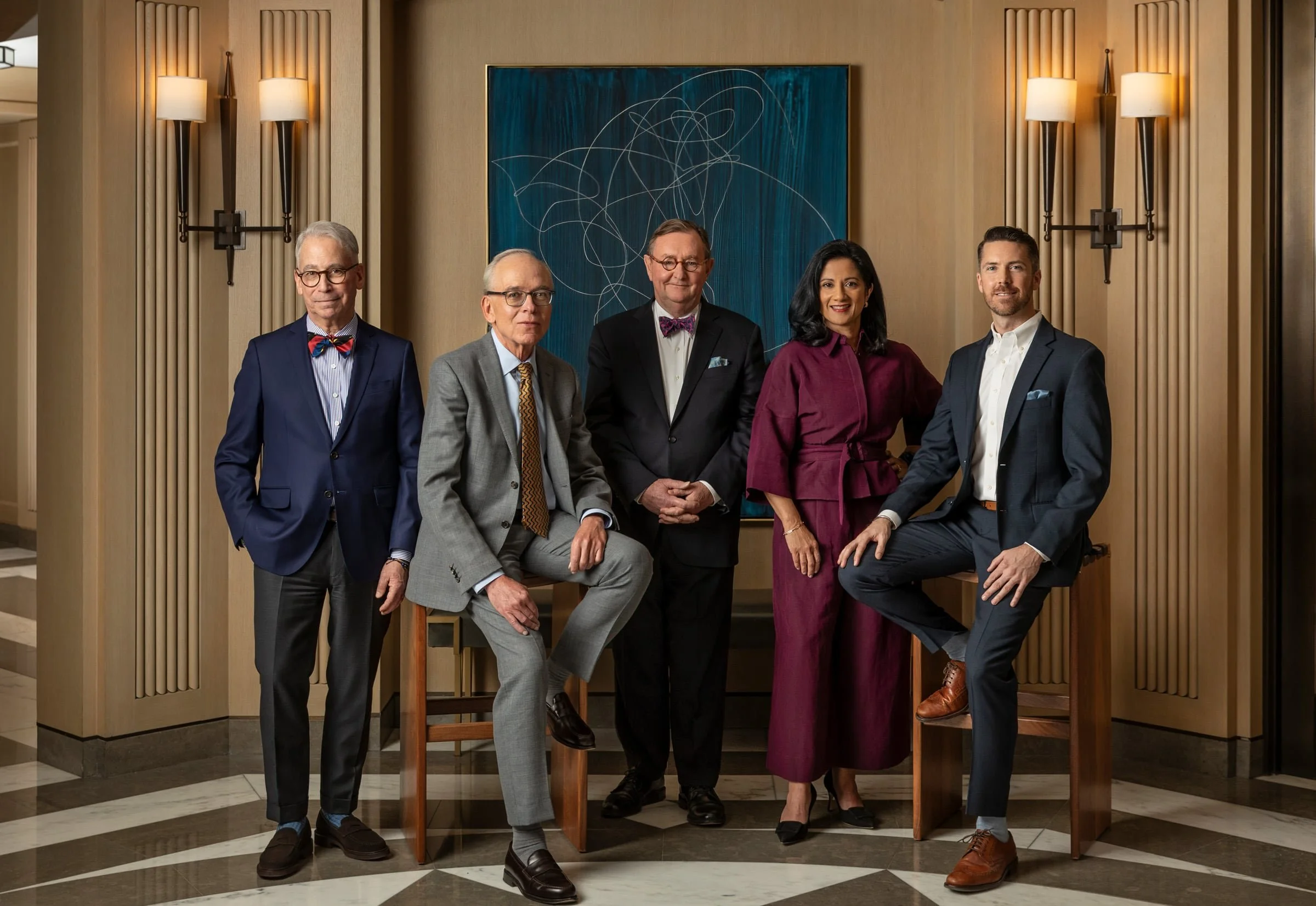 Corporate portrait of a men and women with polished grooming and natural skin finish by NYC makeup artist