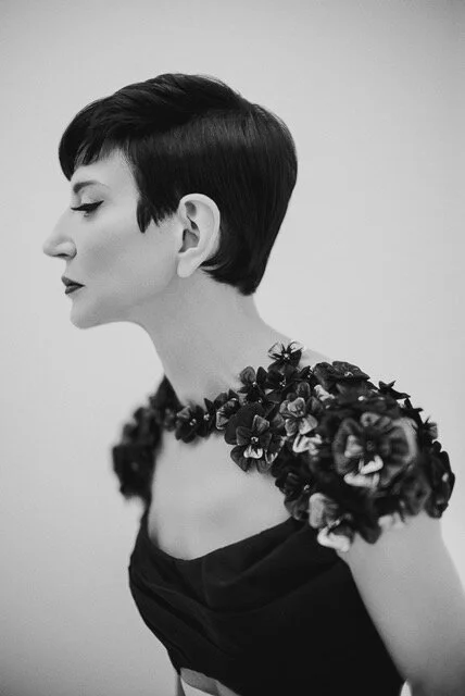 Amy Fine Collins portrait with polished hair and bold makeup look, styled by Maysoon Faraj