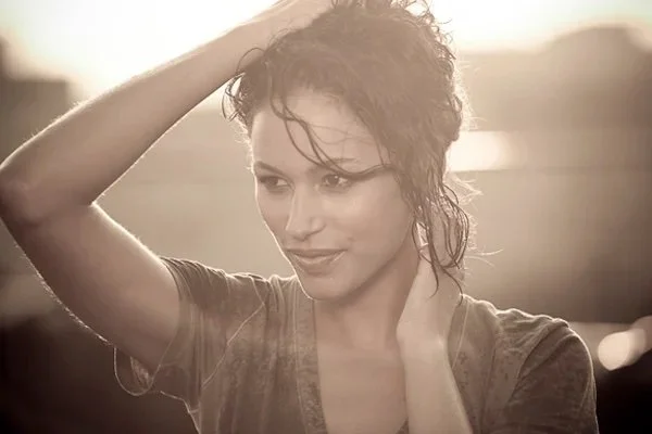 Outdoor lifestyle photo featuring glowing skin and relaxed hairstyle by New York makeup artist and hairstylist