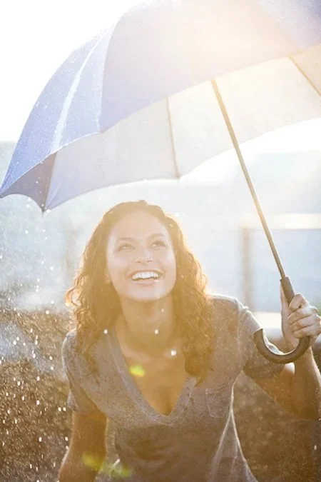 Outdoor lifestyle photo featuring glowing skin and relaxed hairstyle by New York makeup artist and hairstylist