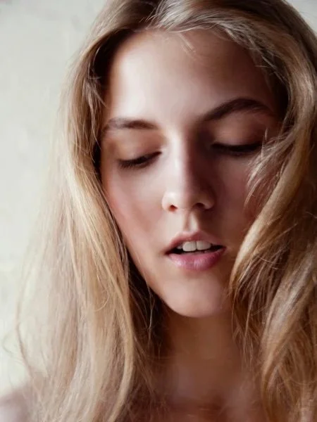 Editorial beauty image featuring natural makeup and styled hair by New York hair and makeup artist