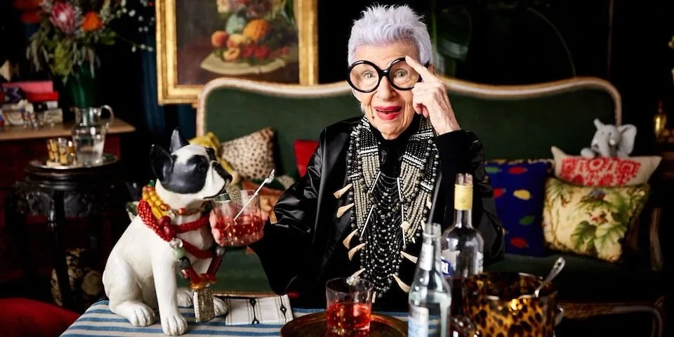 Iris Apfel portrait for One Kings Lane with signature glasses, bold red lips, and professional hair and makeup by NYC makeup artist and hairstylist