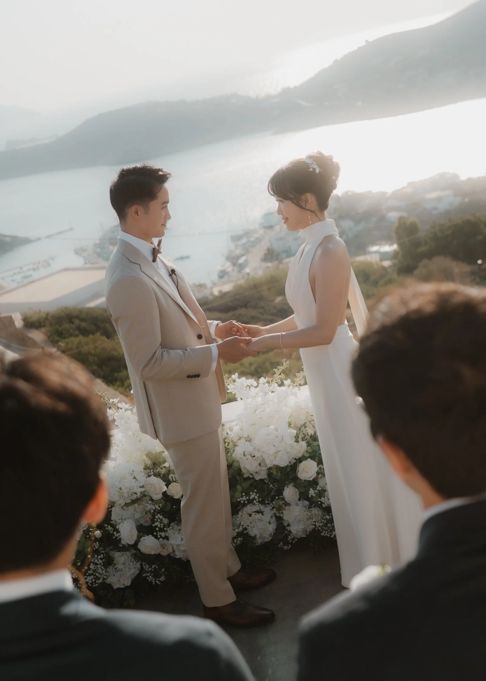 Couple-during-ceremona-at-destination-wedding-in-Ios-Greece