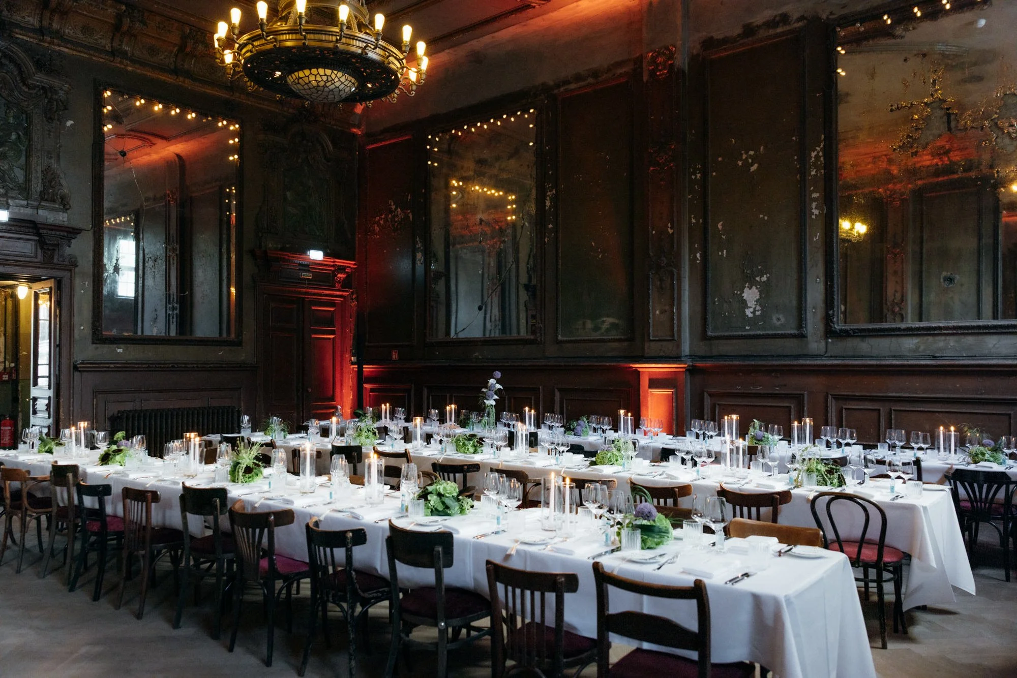 Decorated dinner tables in the mirror hall at Clärchens Ballhaus Berlin