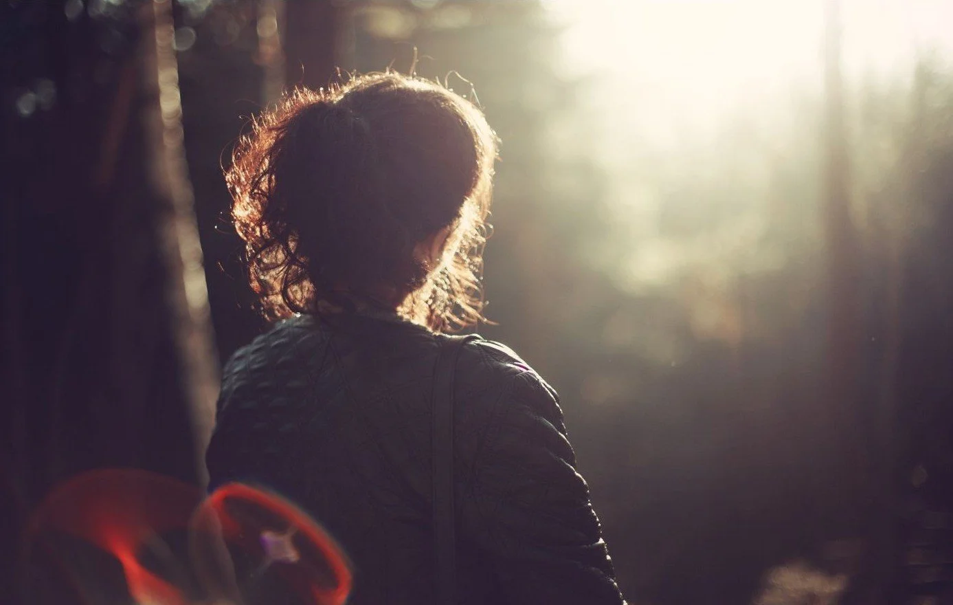 Woman-in-Forest-Gazing-Towards-Sunset.jpg