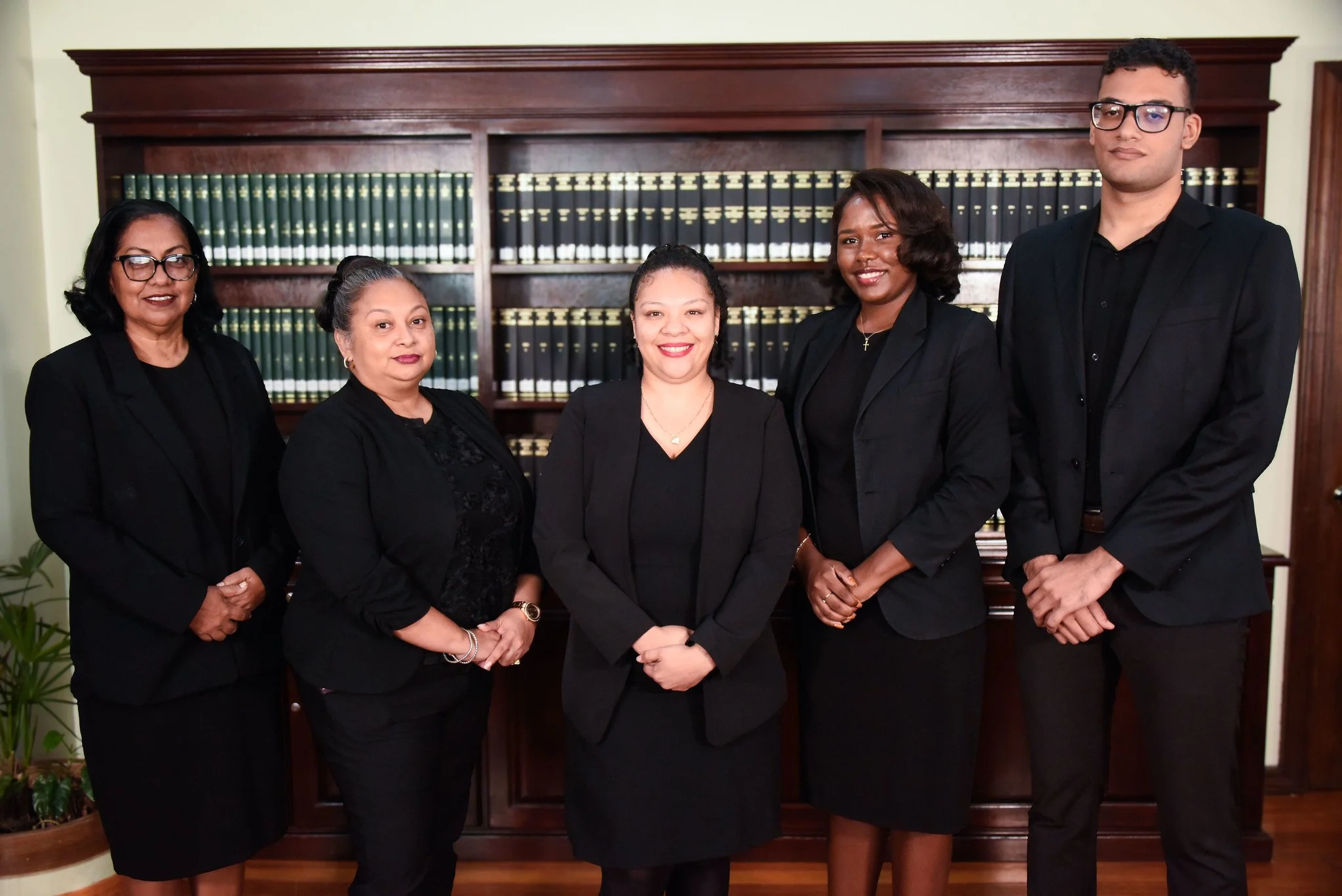 Corporate Department: Lisa Peyrefitte (Corporate Manager), Michelle Cocom (Compliance Officer), Natavia Marin (Corporate Officer), Leah Brown (Intellectual Property Officer), and James Courtenay (Trainee Corporate Officer)