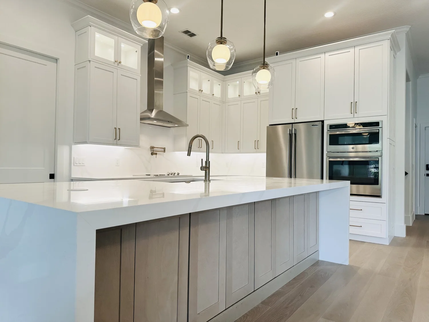 Lake Cawood kitchen remodel with white cabinetry and wood island