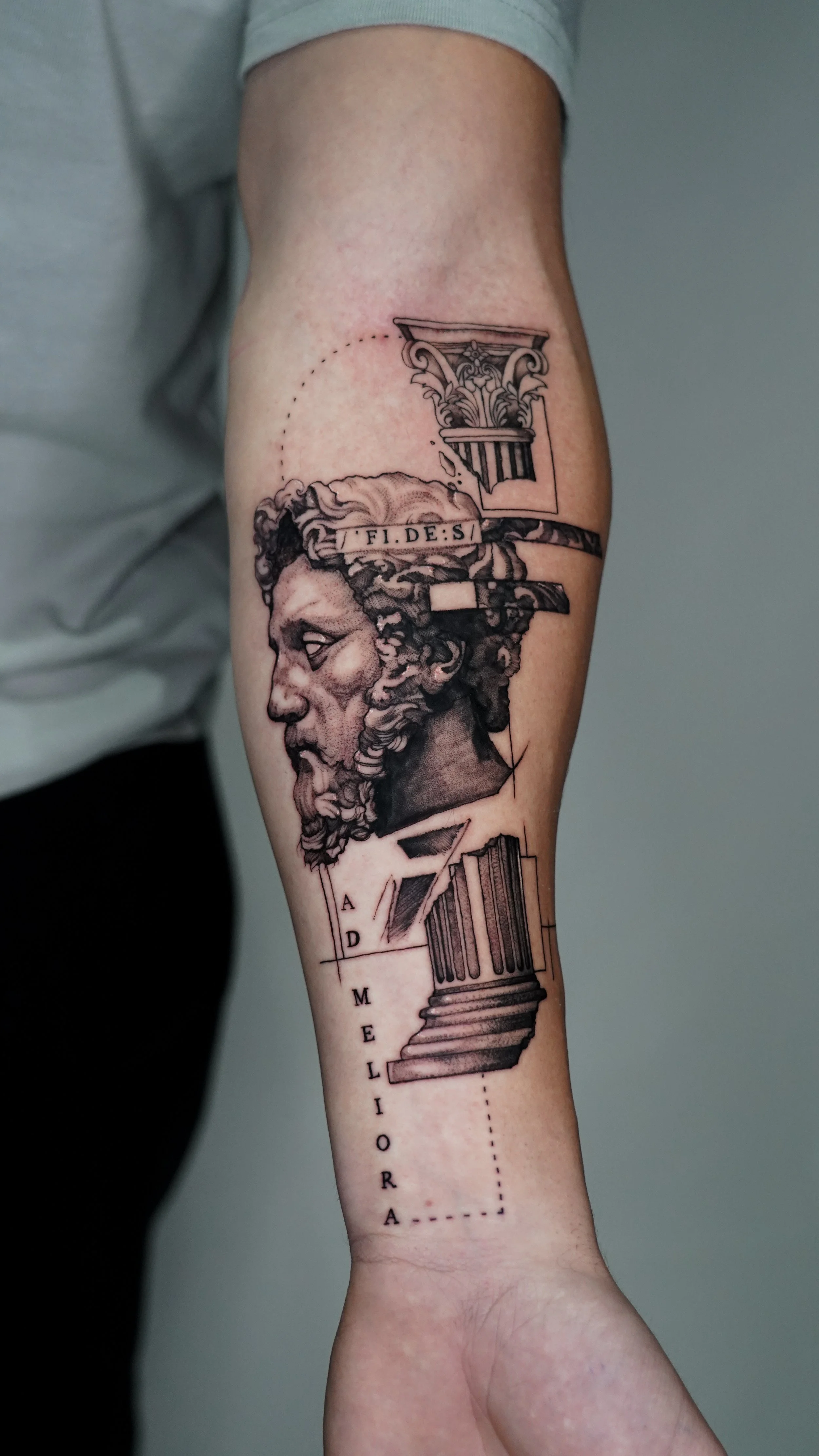 Tattoo of a classical Greek sculpture of a man's bust created by a brighton tattoo artist