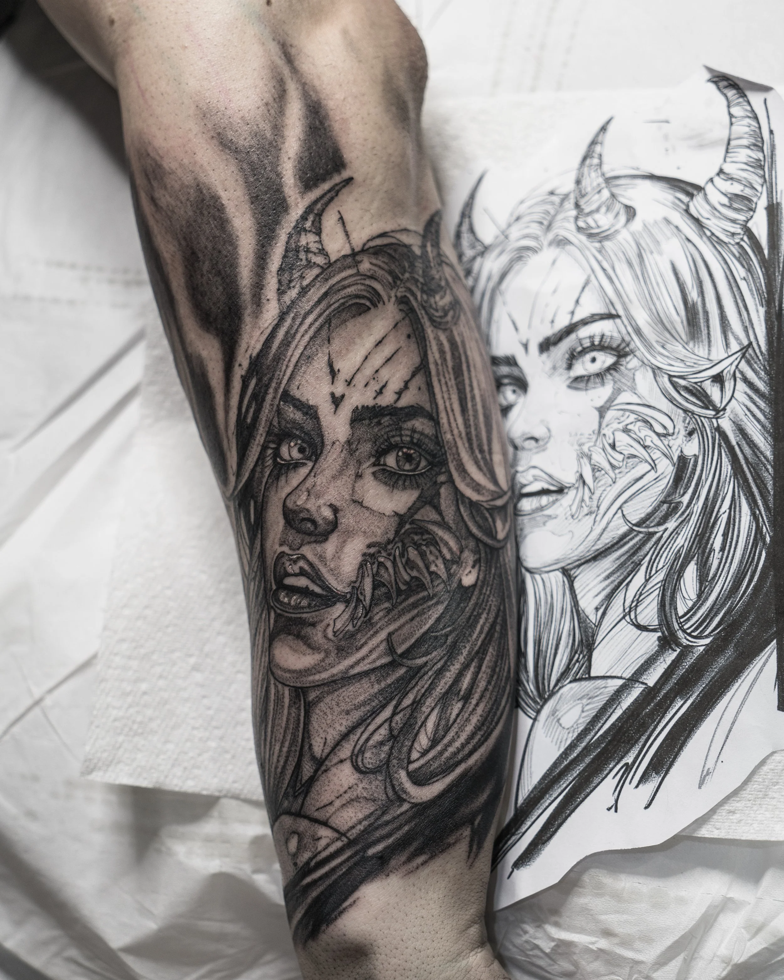 demon girl tattoo on forearm