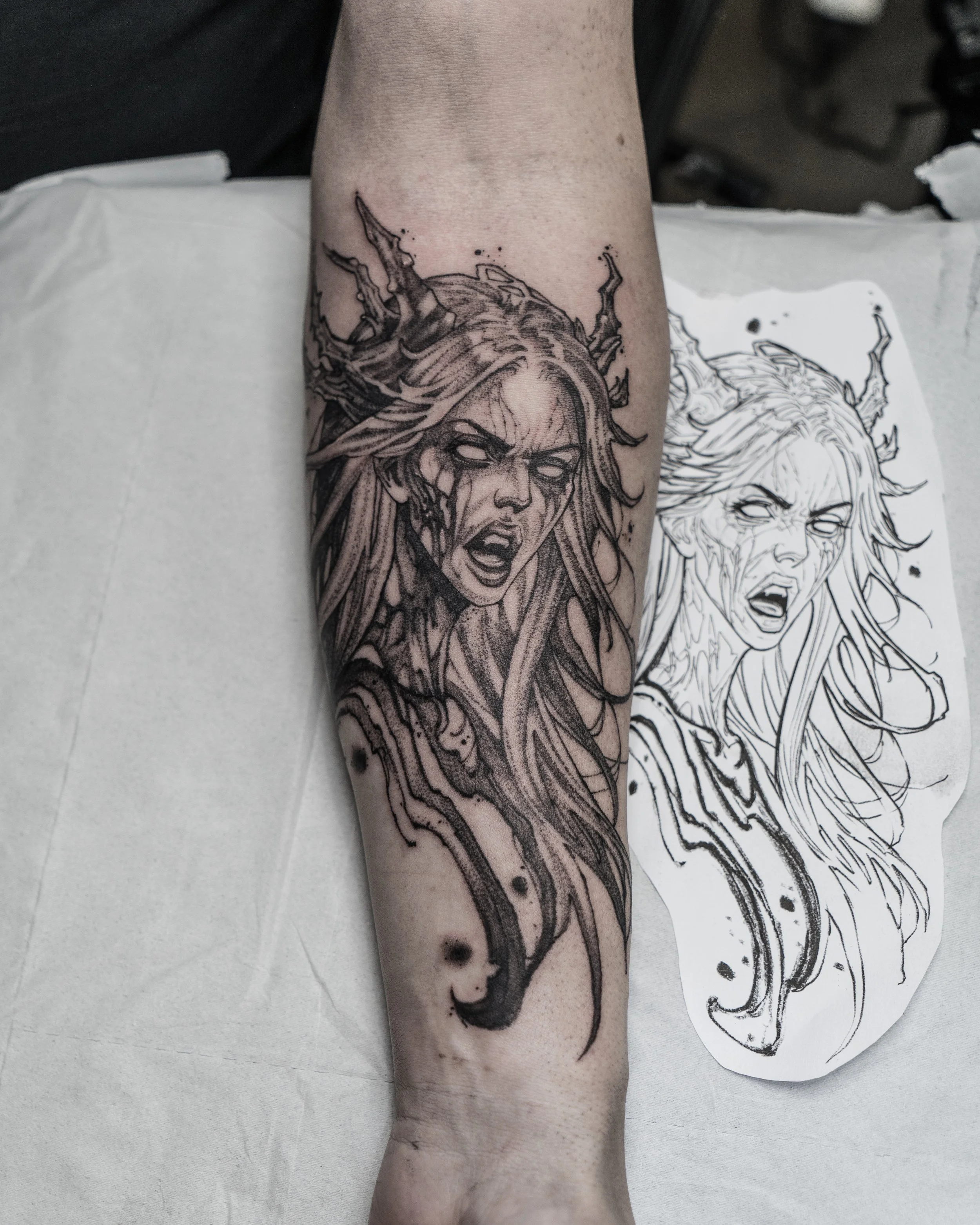 banshee tattoo on forearm