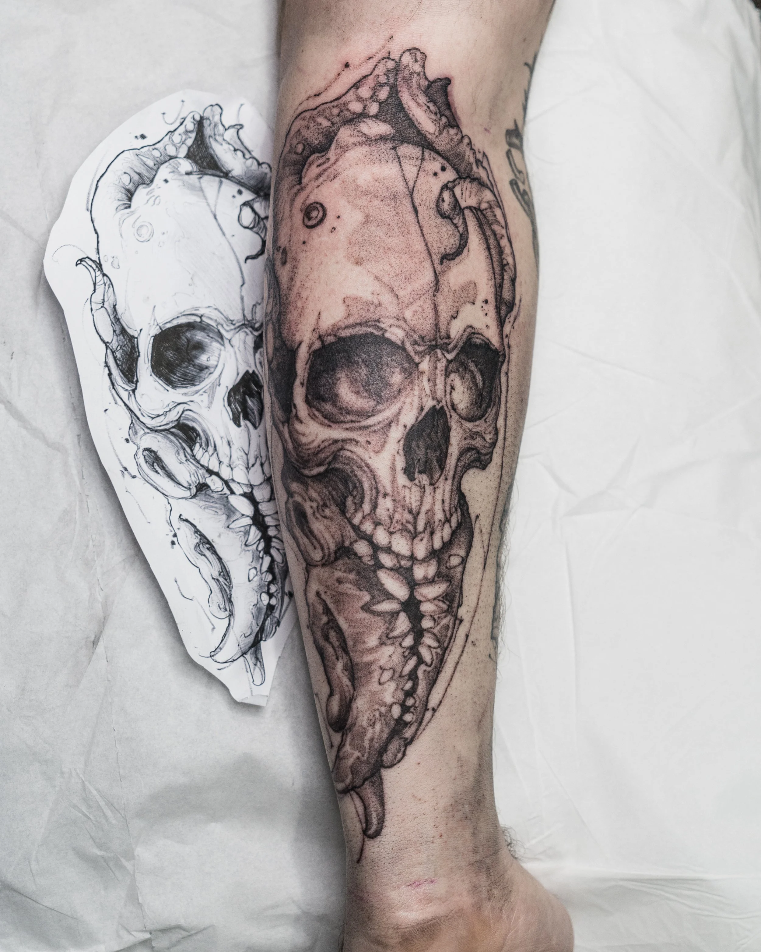 skull tattoo on forearm