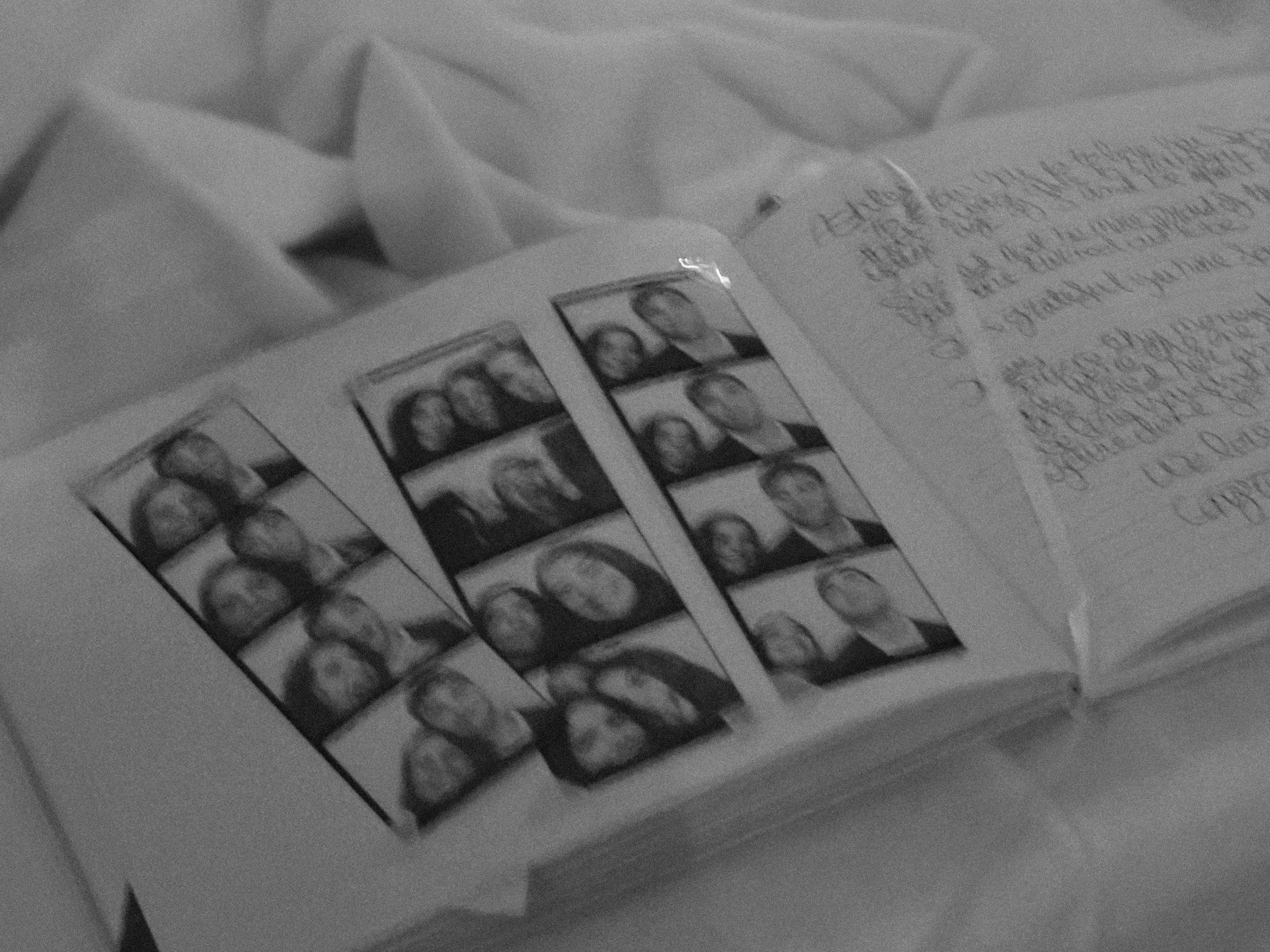 A photo of a photo booth strip album at a wedding.