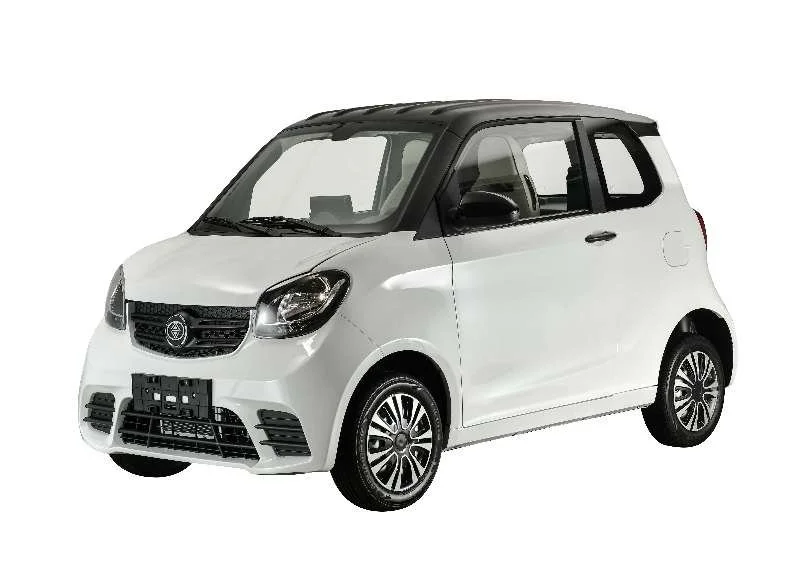 White compact electric car with black roof and black accents on a plain white background