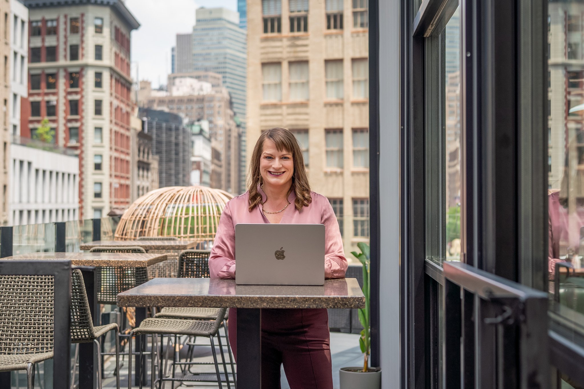 MerriLyn working on a laptop during a New York City personal brand photography session