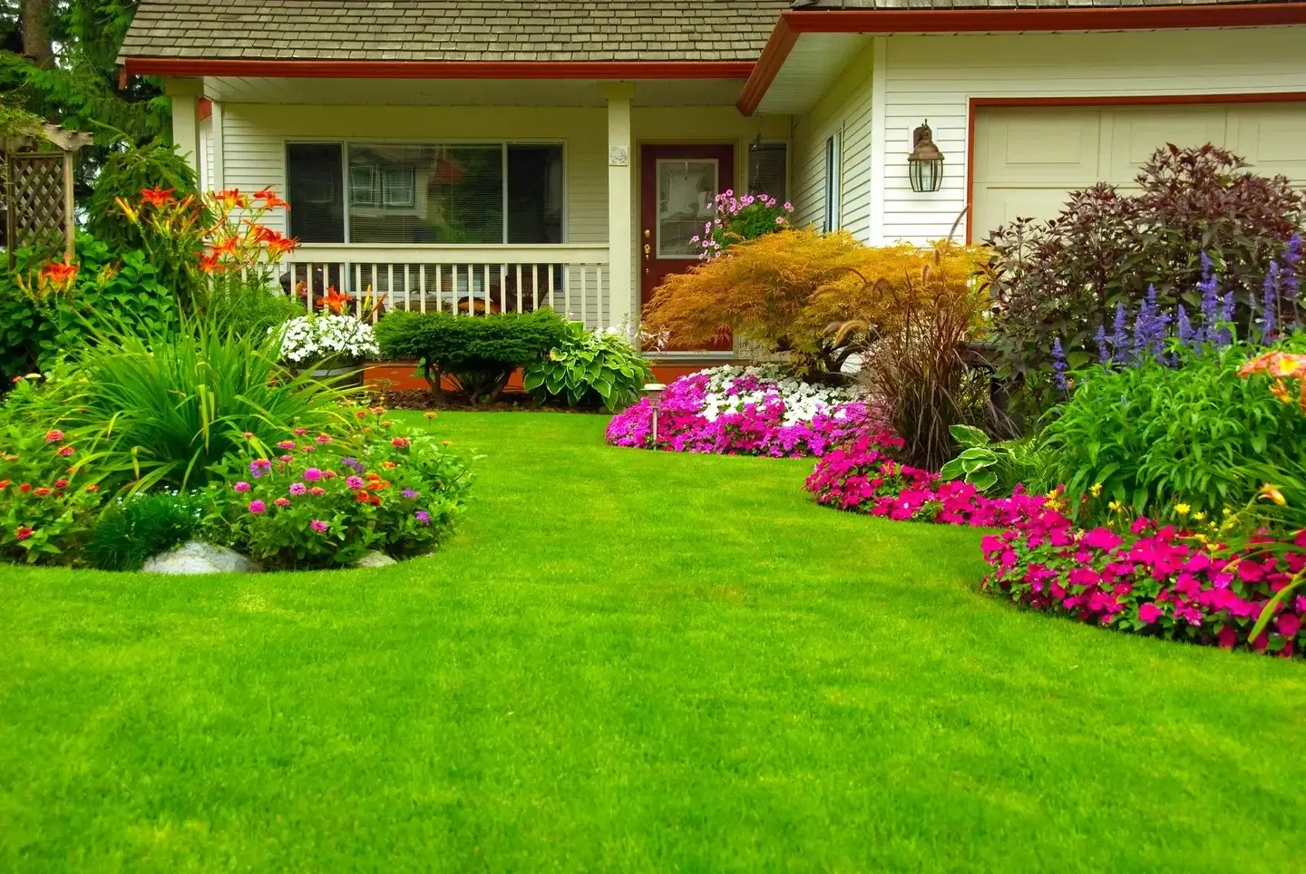 Clean, landscaped front yard after professional yard cleanup and planting in Portland, Oregon.