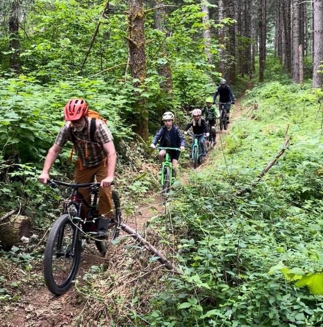Dennis leading kids down Tree Prison.jpg
